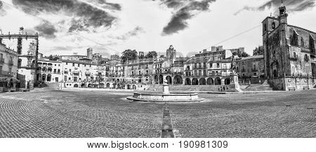 Trujillo Spain - June 4 2017: Panoramic view of Plaza Mayor at Trujillo Spain. Granite fountain in the middle