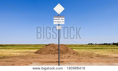 Route 66 midpoint sign on road side
