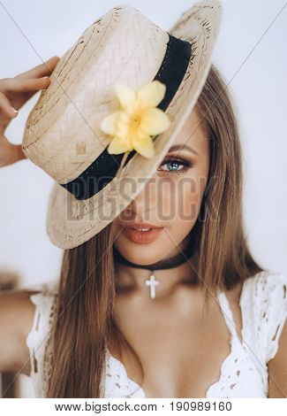 Photo of beautiful young woman with makeup in fashion clothes