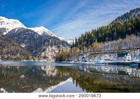 Lake Ritsa In The Caucasus And Mountains Covered With Forest In Early Spring. Abkhazia