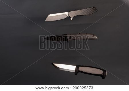 A Few Knife On A Gray Background. Three Sharp Knife.