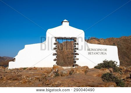 Gate Of Betancuria - Traditional Municipal Sign (white Arch) On Fuerteventura, Canary Islands, Spain