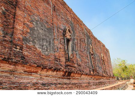 Ruined Wall Of Buddhist Chapel With Brick Surface In An Old Wat (temple) In Ayutthaya, Thailand.
