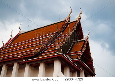 Fine-art Roof Top Of Main Chapel At Wat Kalayanamitr Temple On Cloudy Blue Background