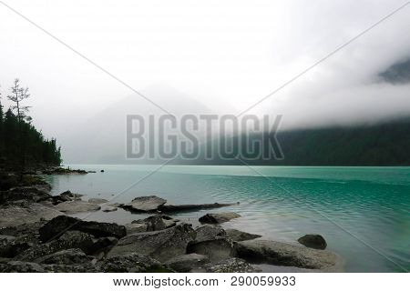 Marvellous View At Foggy Kucherla Mountain Lake. Belukha National Park, Altai Republic, Siberia, Rus