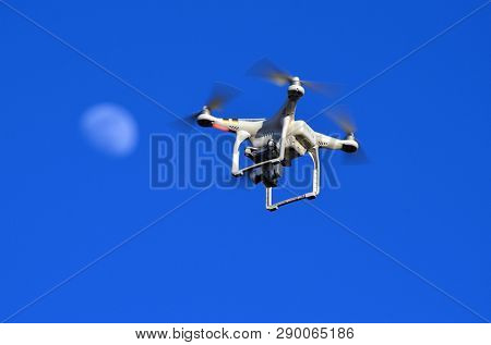 Drone and Moon.Drone quadrocopter Phantom 3 Professional with high resolution digital camera . March 17, 2019. Near Kiev,Ukraine