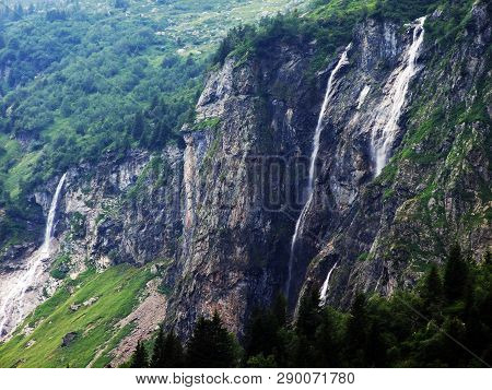 Waterfall Milchbachfall Or Wasserfall Milchbachfäll, Milchbäch Stream In The Alpine Valley Of Madera