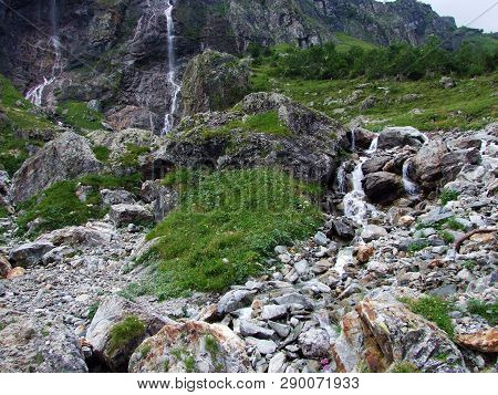 Waterfall Milchbachfall Or Wasserfall Milchbachfäll, Milchbäch Stream In The Alpine Valley Of Madera