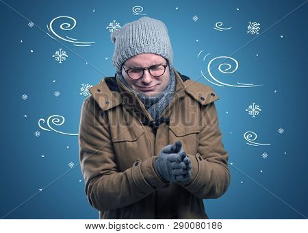 Young hipster frozen boy with doodled snowflakes and windy concept