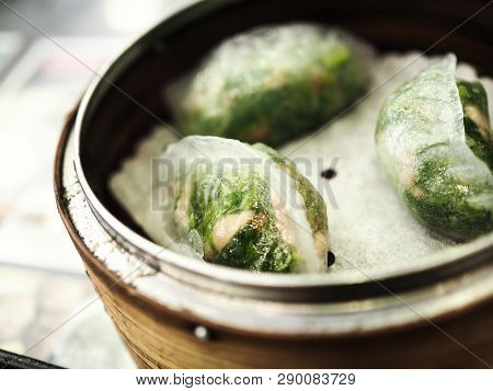 Three Chinese Vegetable​ Dumplings On​ Bamboo​ Steamer Basket.​