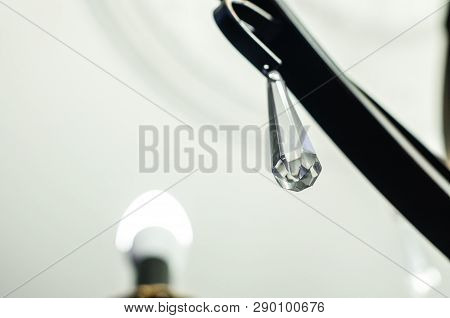 Piece Of Glass Hanging From The Handelier.  Room Or House Decor Interiors. Lightning In The Restaura
