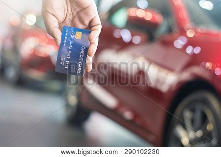 Man Holding Credit Card For Car Blurred Bokeh Background E-shopping Marketing Digital, Consumer Purc