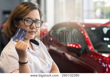 Asian Woman Holding Credit Card For Car Blurred Bokeh Background E-shopping Marketing Digital, Consu