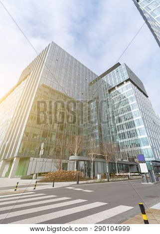 Warsaw Poland. February 18, 2019. Business Center. Glass Building. Against The Sky. Crosswalk.