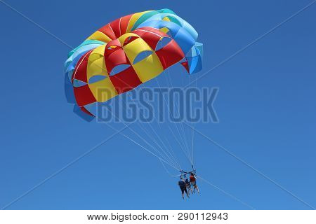 Parasales, Rasailing Water Parachutes For Outdoor Activities. In The Blue Sky Triple Water Parachute