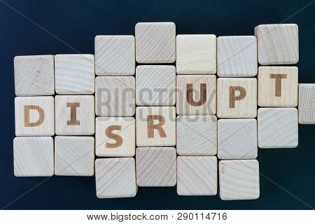 Business Disruption, Evolve Or Game Changer Concept, Straggle Cube Wooden Blocks With Some Combine T