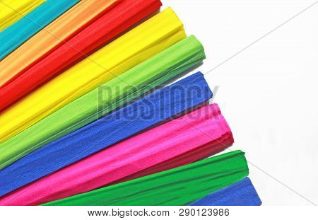 Multi Colored Rolls Of Crepe Paper Fanned Out On White Background