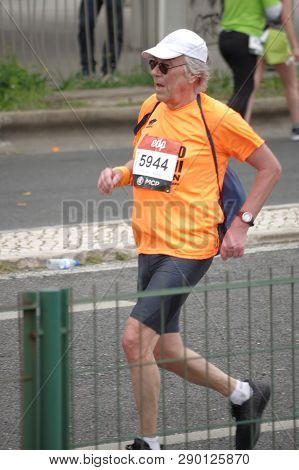 Lisbon, Portugal - March 17 2019: Elder Male Distance Runner At The Edp Lisbon Half Marathon