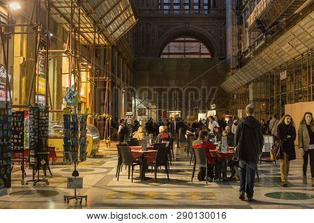 Naples, Italy - October 31, 2015: Unknown People Resting In The Galleria Umberto I At Evening. Galle