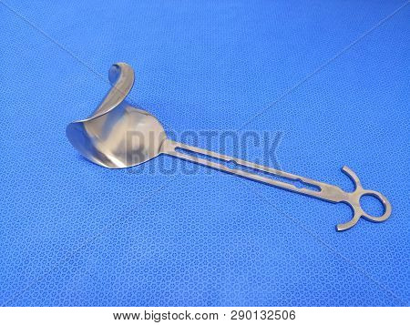 Closeup Image Of Doyen Abdominal Retractor In Blue Background