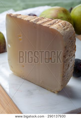 Piece Of French Cheese Tomme De Brebis Made From Sheep Milk Served As Dessert With Fresh Figs And Pe
