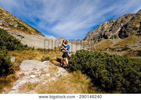 Tourists Trekking In Beautiful Mlynicka Dolina On The Way To Bystre Sedlo - In Slovakian High Tatra 