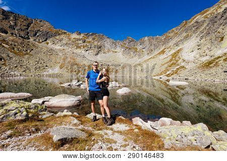 Tourists Trekking In Beautiful Mlynicka Dolina On The Way To Bystre Sedlo - In Slovakian High Tatra 