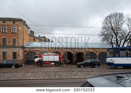 Riga, Latvia - March 16, 2019: Fire Truck Is Being Cleaned - Driver Washes Firefighter Truck At A De