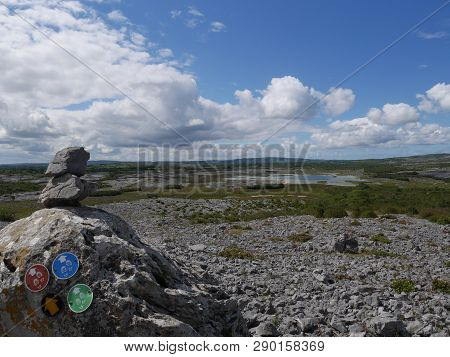 Rocks In The Burren In Ireland. View On A Lake. Blue Sky. Hike In The Burren.