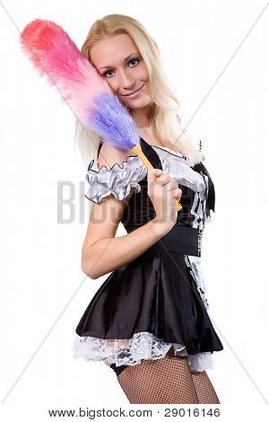 beautiful blonde in a dress of the parlourmaid and with a whisk in hands. Isolated on white