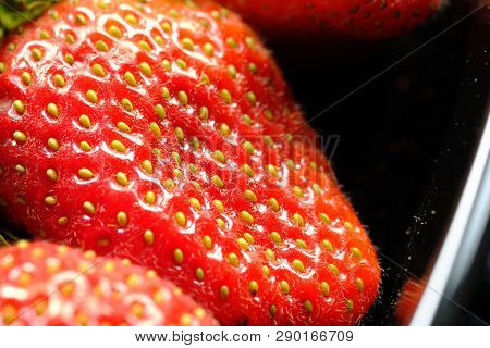 Close Up Of Fresh Red Ripe Strawberries In Plastic Container Box