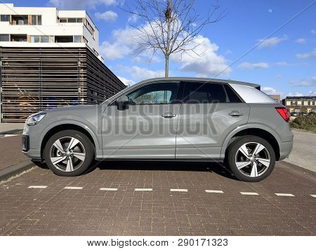 Almere, The Netherlands - March 18, 2019: Grey Audi Q2 Parked On A Public Parking Lot. Nobody In The