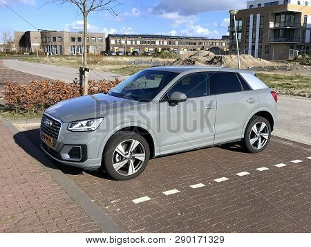 Almere, The Netherlands - March 18, 2019: Grey Audi Q2 Parked On A Public Parking Lot. Nobody In The