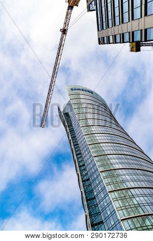 Warsaw Poland. February 18, 2019. Business Center. Glass Building. Against The Sky.