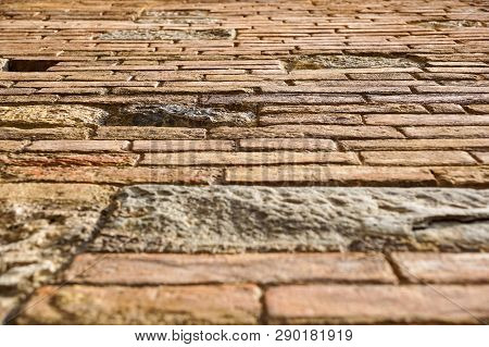 An Stone Wall Of A Building From The Ground Prespective Looking Up. Brick Wall