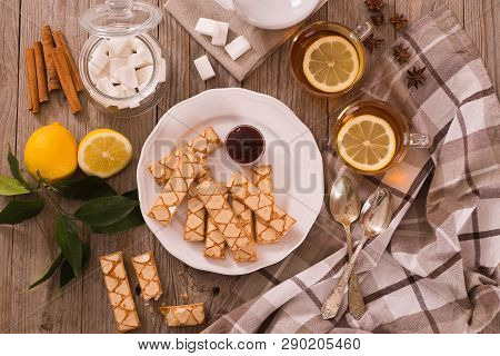 Puff Pastry Cookies With Jam On White Dish.