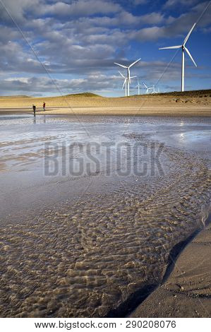 Windmills On The Maasvlakte 2 Seen From The Maasvlakte Beach