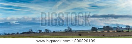 Panorama, Hanging Clouds Over A Mountain Range.