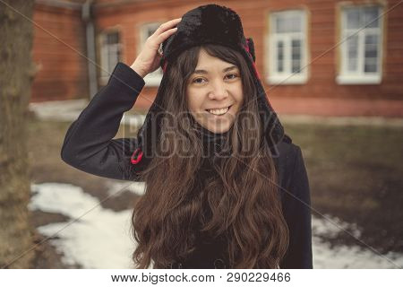 Portrait Of A City Girl In A Blue Jacket. Girl Walking In The Fresh Air
