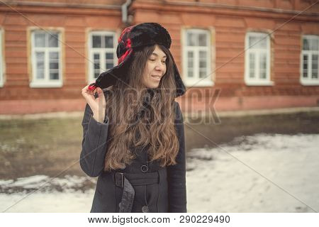 Portrait Of A City Girl In A Blue Jacket. Girl Walking In The Fresh Air