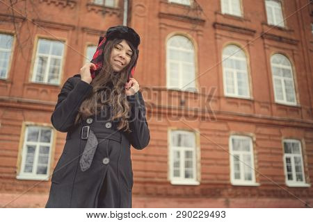 Portrait Of A City Girl In A Blue Jacket. Girl Walking In The Fresh Air