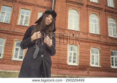 Portrait Of A City Girl In A Blue Jacket. Girl Walking In The Fresh Air