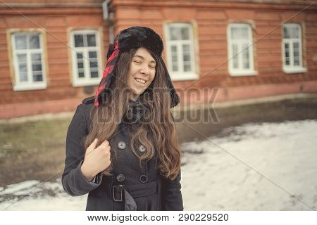 Portrait Of A City Girl In A Blue Jacket. Girl Walking In The Fresh Air