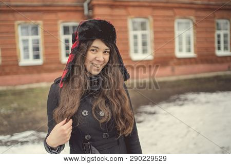 Portrait Of A City Girl In A Blue Jacket. Girl Walking In The Fresh Air