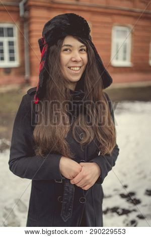 Portrait Of A City Girl In A Blue Jacket. Girl Walking In The Fresh Air