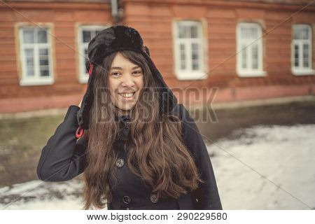 Portrait Of A City Girl In A Blue Jacket. Girl Walking In The Fresh Air
