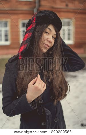 Portrait Of A City Girl In A Blue Jacket. Girl Walking In The Fresh Air