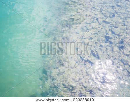 Top View Of Clear Beach Ripple Water With Rock And Black Sea Urchin (arbacia Lixula) On The Sea Floo