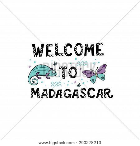 Welcome To Madagascar. Handlettering Frase With Handdrawn Chameleon And Butterfly With Design Elemen