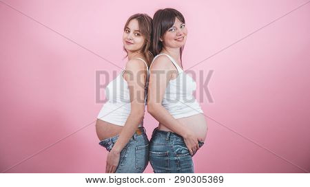 Maternity Concept, Two Pregnant Women With An Open Tummy